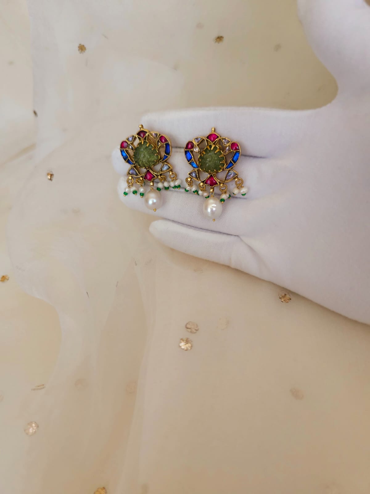 The sacred blue peacock pearl studs