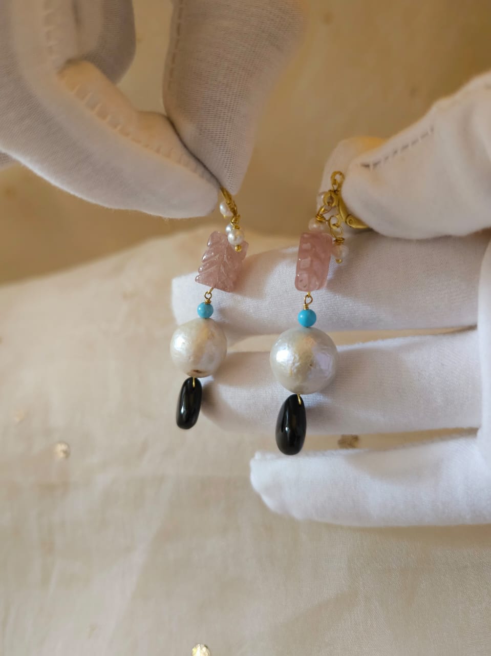 Carved rose quartz and black onyx earrings