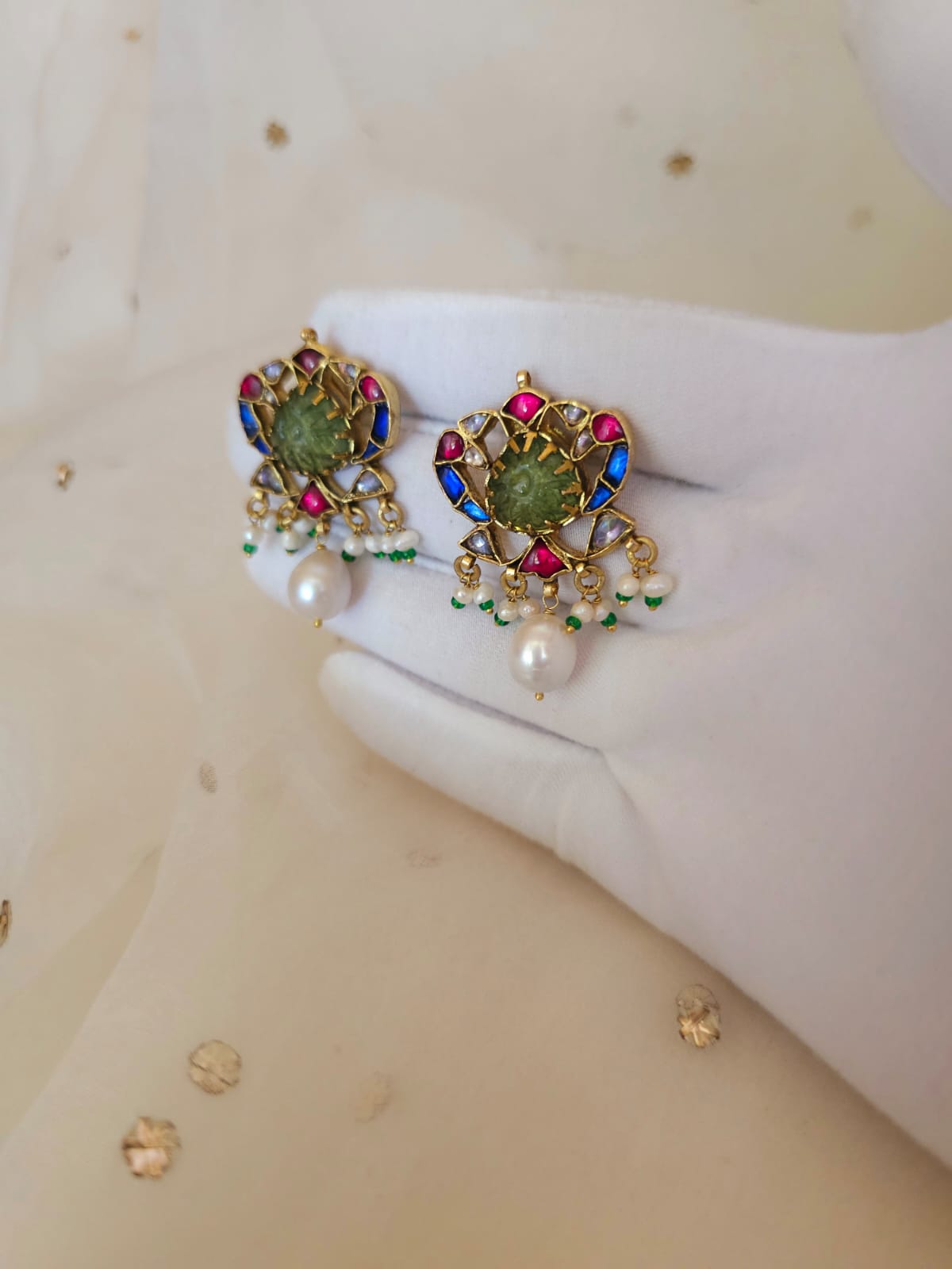 The sacred blue peacock pearl studs
