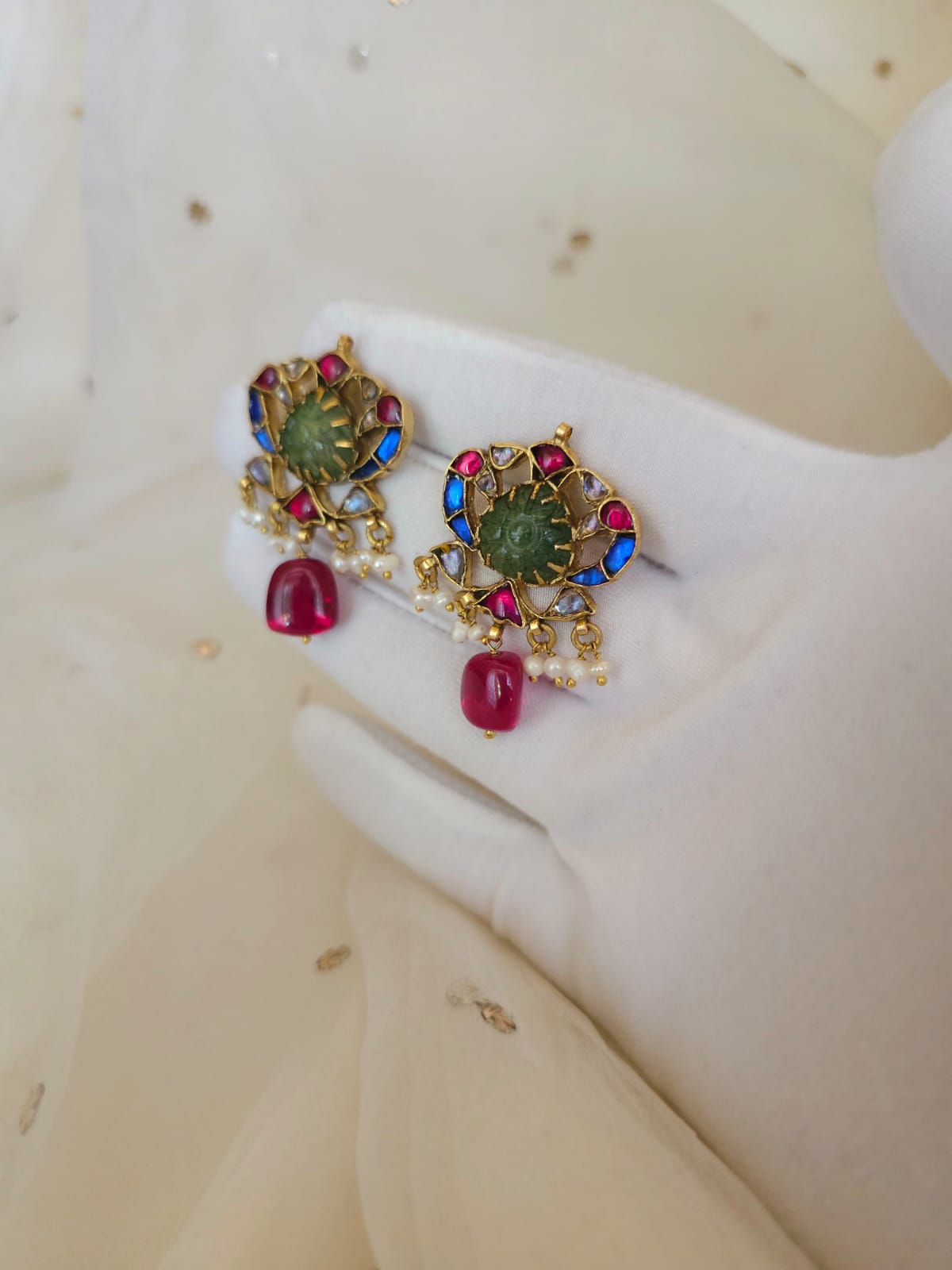 The sacred blue peacock spinel studs