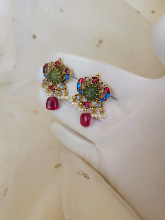 The sacred blue peacock spinel studs