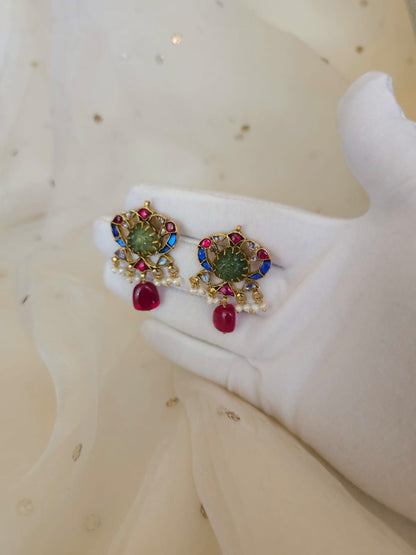The sacred blue peacock spinel studs