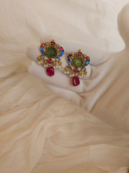 The sacred blue peacock spinel studs